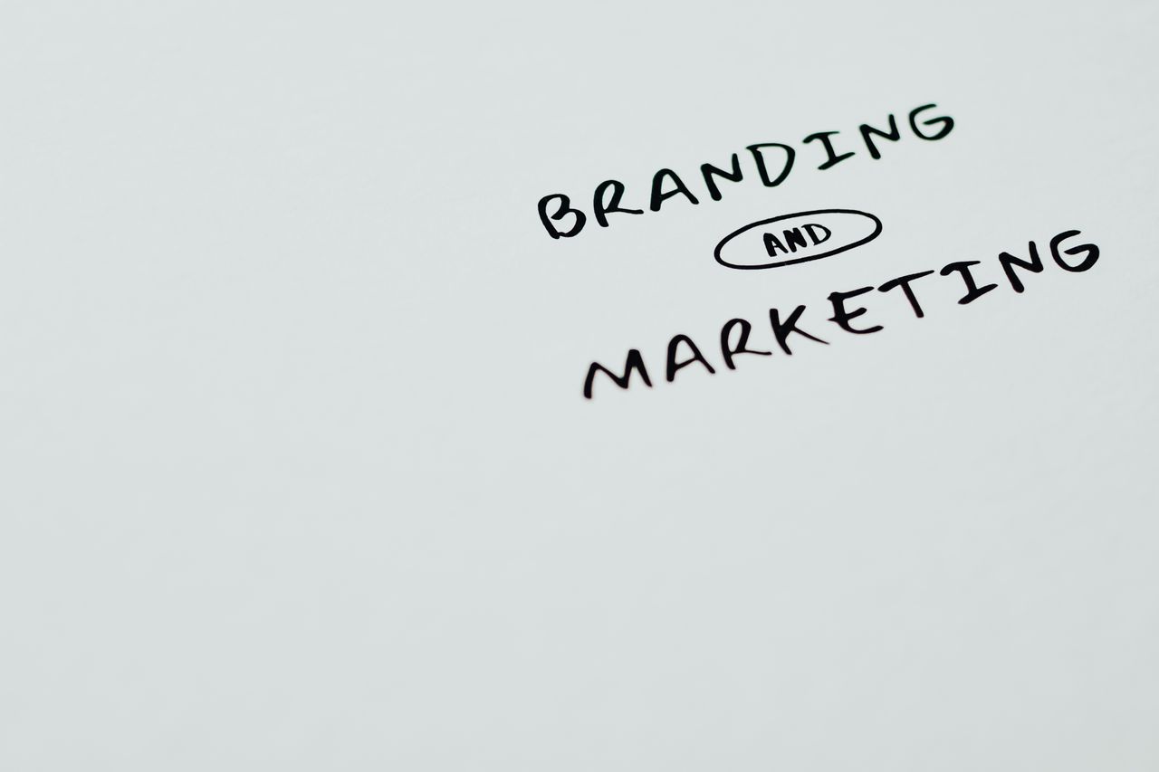 about-us-01 A minimalist image featuring the words Branding and Marketing on a white background, ideal for digital marketing themes.